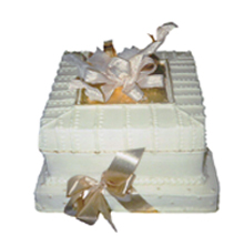 Photograph of one of the package cakes designed using edible gold leaf.
