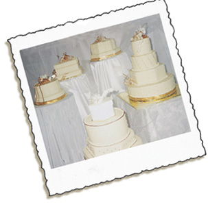 Photograph of gold and white cake display.