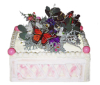 one of a display of cakes designed like flower boxes filled with late summer flowers
