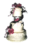 three tiered wedding cake with garland of silk flowers